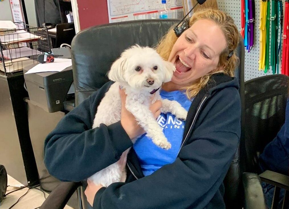 Sit Means Sit trainer holding maltese